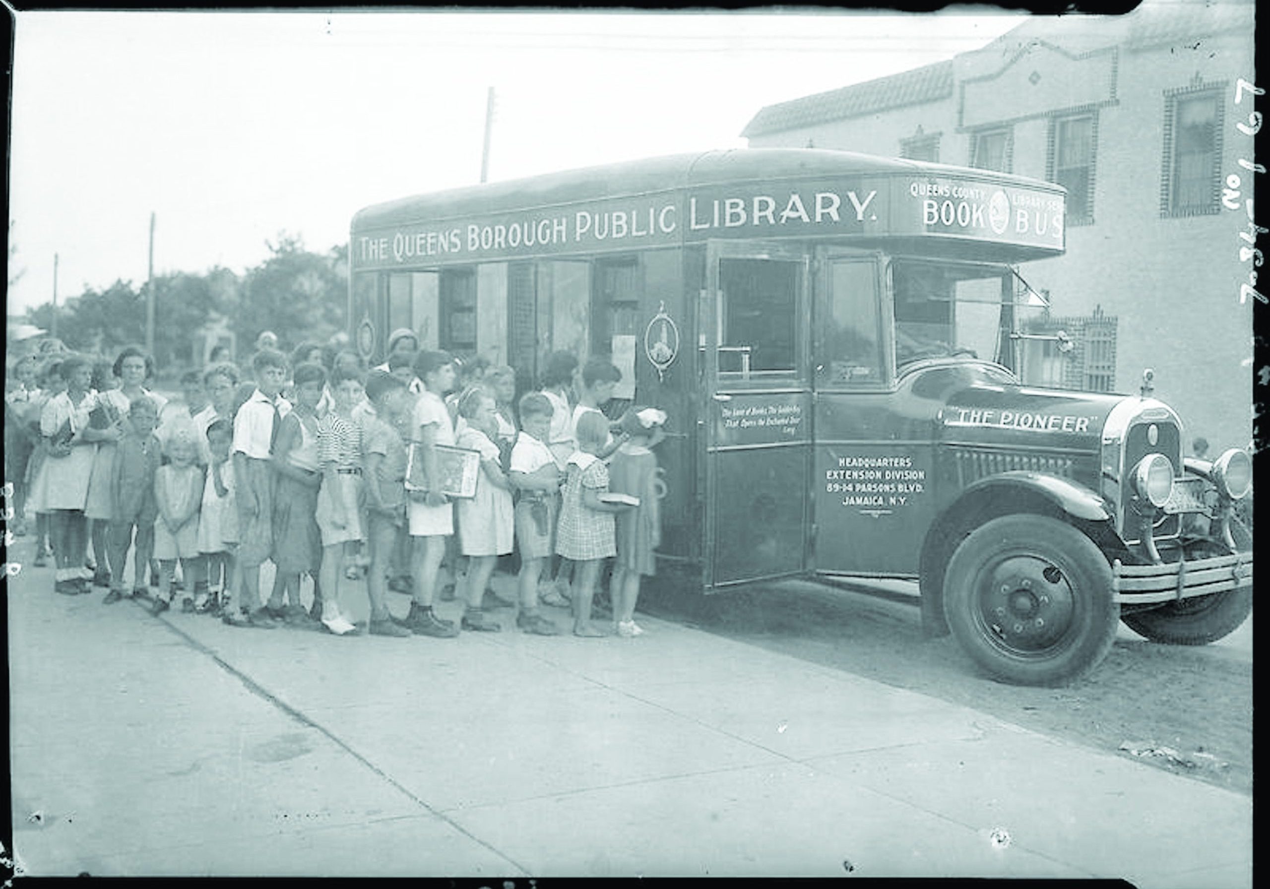Photo Courtesy Queens Public Library Archives
Youngsters line up for the Queens Public Library book mobile during its summer reading program circa 1925.
